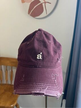 Burgundy Distressed Baseball Cap with 'á' Accent Logo